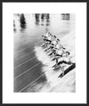 ROW OF WOMEN WATER SKIING